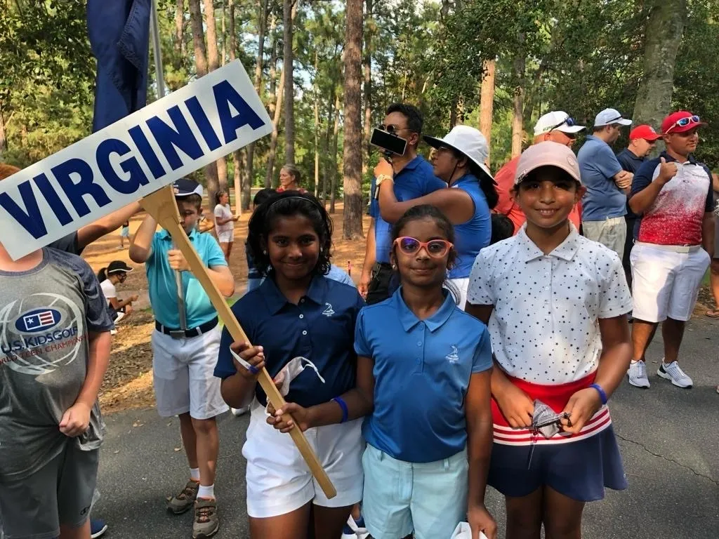 A group of young people standing next to each other.