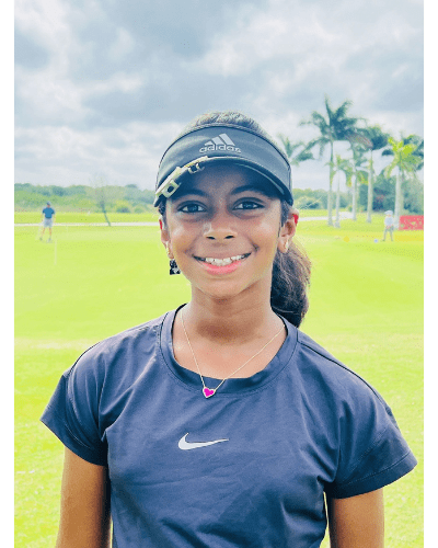 A young girl is smiling for the camera.